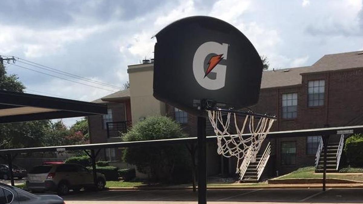Some anonymous Arlington police officers replaced this broken basketball goal in an Arlington neighborhood for Christmas.