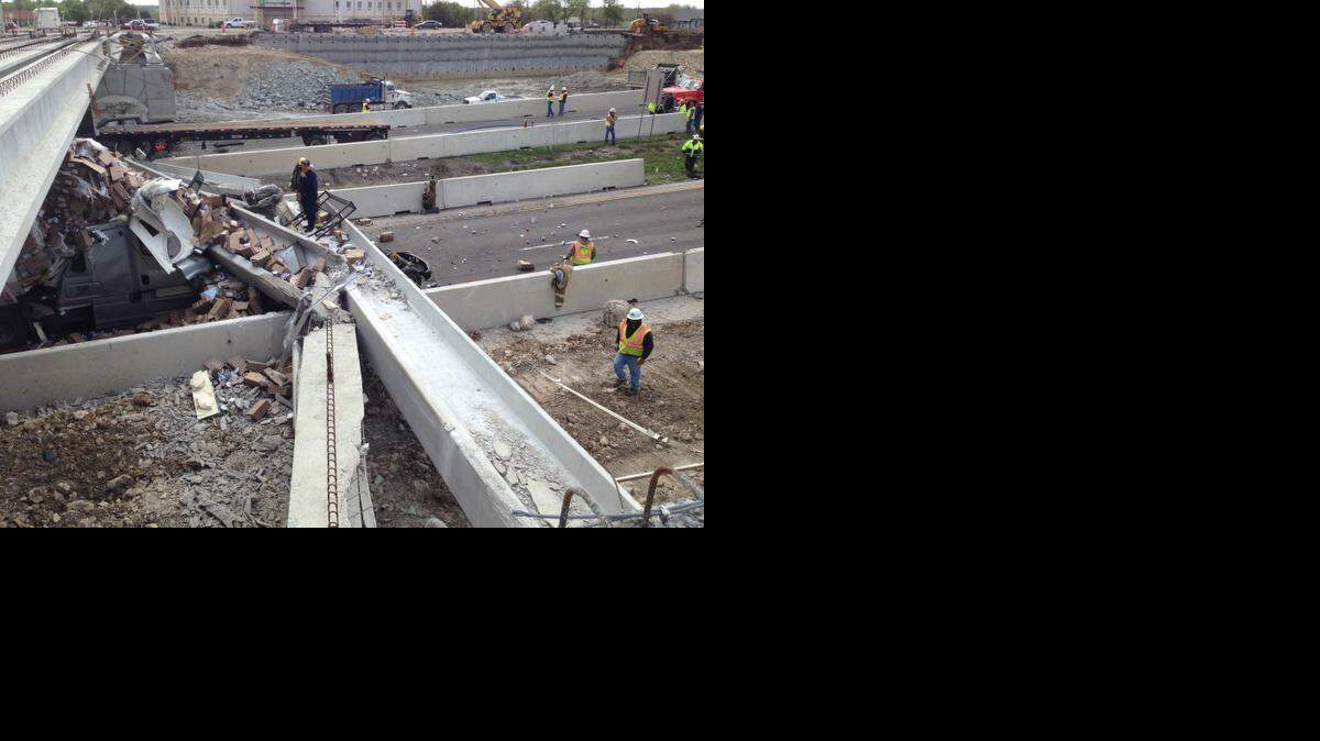 
A concrete beam lies across a mangled truck on Interstate 35 in Salado. The truck hit a beam on a bridge under contruction in Salado Thursday morning. Several beams then toppled onto other vehicles, authorities said. 
