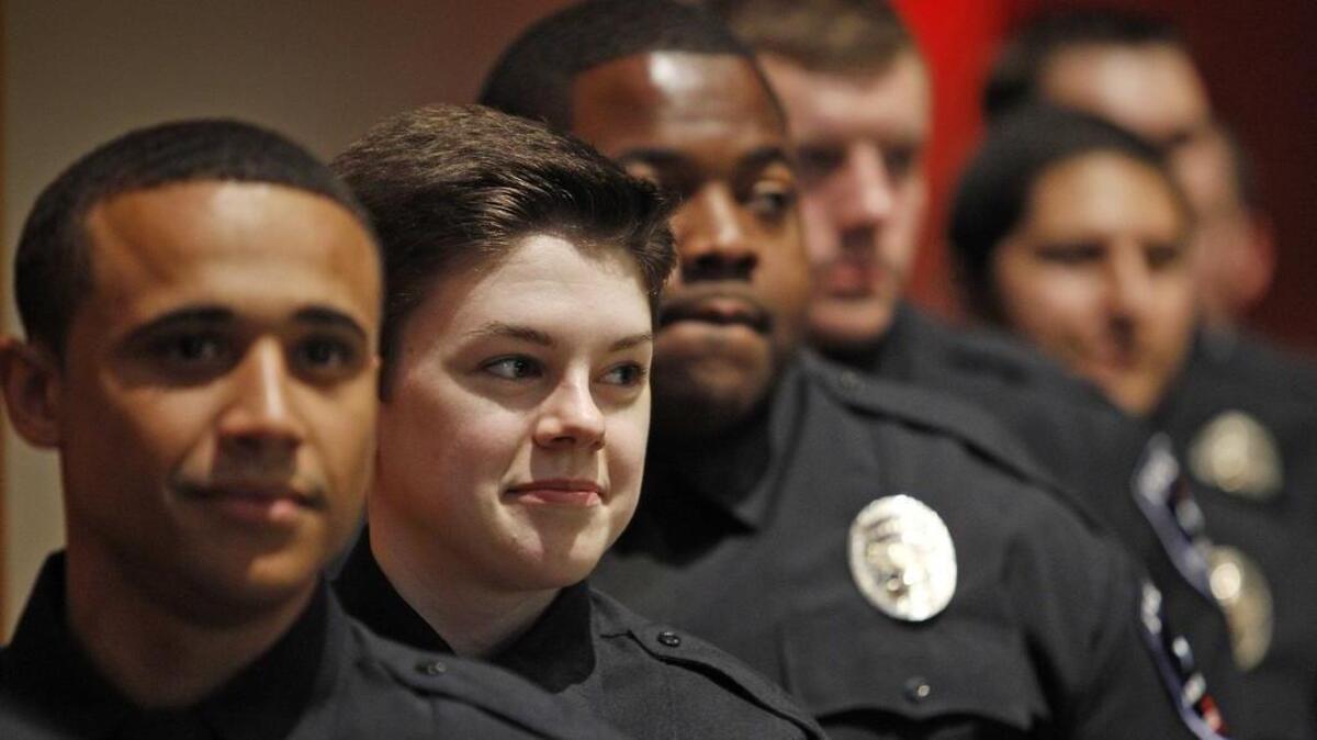 Some members of Arlington Police Academy Class 50 at their graduation in July. The Arlington Police Department is applying for a Homeland Security Department grant that would help police build on relationships with the Muslim community.