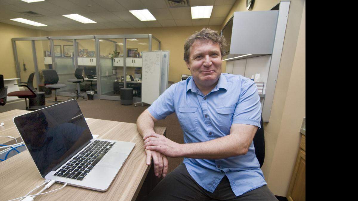 
George Siemens, executive director of the Learning Innovations & Networked Research Lab (LINK) at UT Arlington, in a research room in Nedderman Hall that was part of a tour on characteristics that could make up the office of the future.
