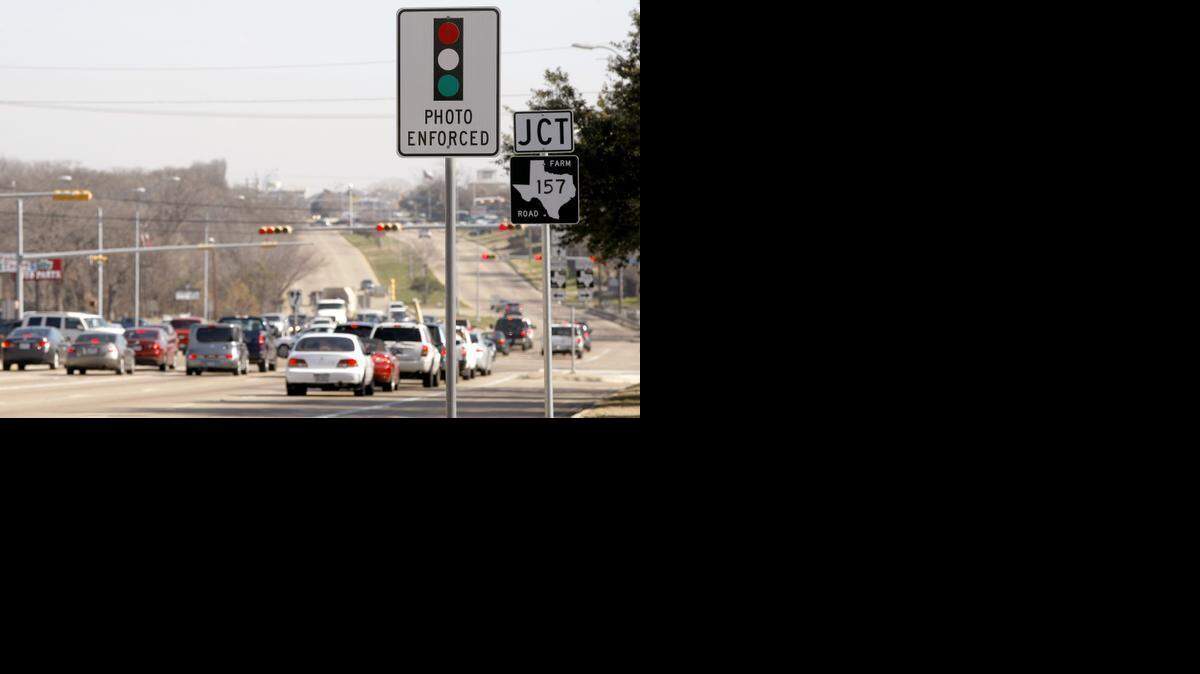 
The intersection of Pioneer Parkway at Cooper Street is photographed in Arlington on Tuesday, January 20, 2015. Some Arlington residents are filing a petition to ban red light cameras. 
