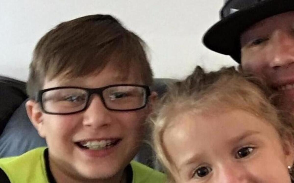 Community rallies around Arlington EMT, Damian Jay, shown with his two children, as he battles a cancer diagnosis.