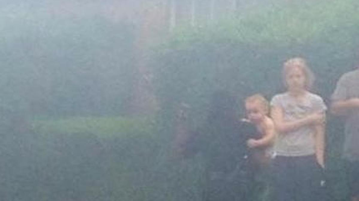 
Arlington police officer K. Johnson carried a baby out of a burning apartment complex Tuesday.
