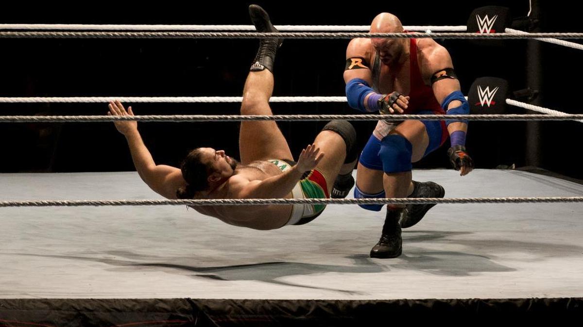 WWE wrestler Ryback, right, throws down Alexander Rusev during WWE Live India Tour in New Delhi on Jan. 15. WrestleMania is shooting for an attendance record Sunday at AT&T Stadium in Arlington.