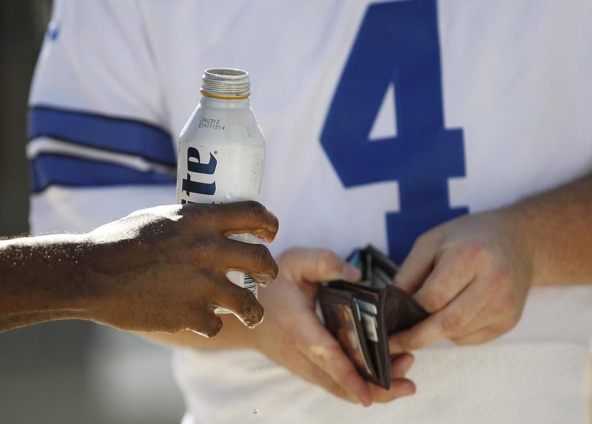 A fan buys a beer at AT&T Stadium before the Los Angeles Rams play the Dallas Cowboys at AT&T Stadiium on Oct. 1.