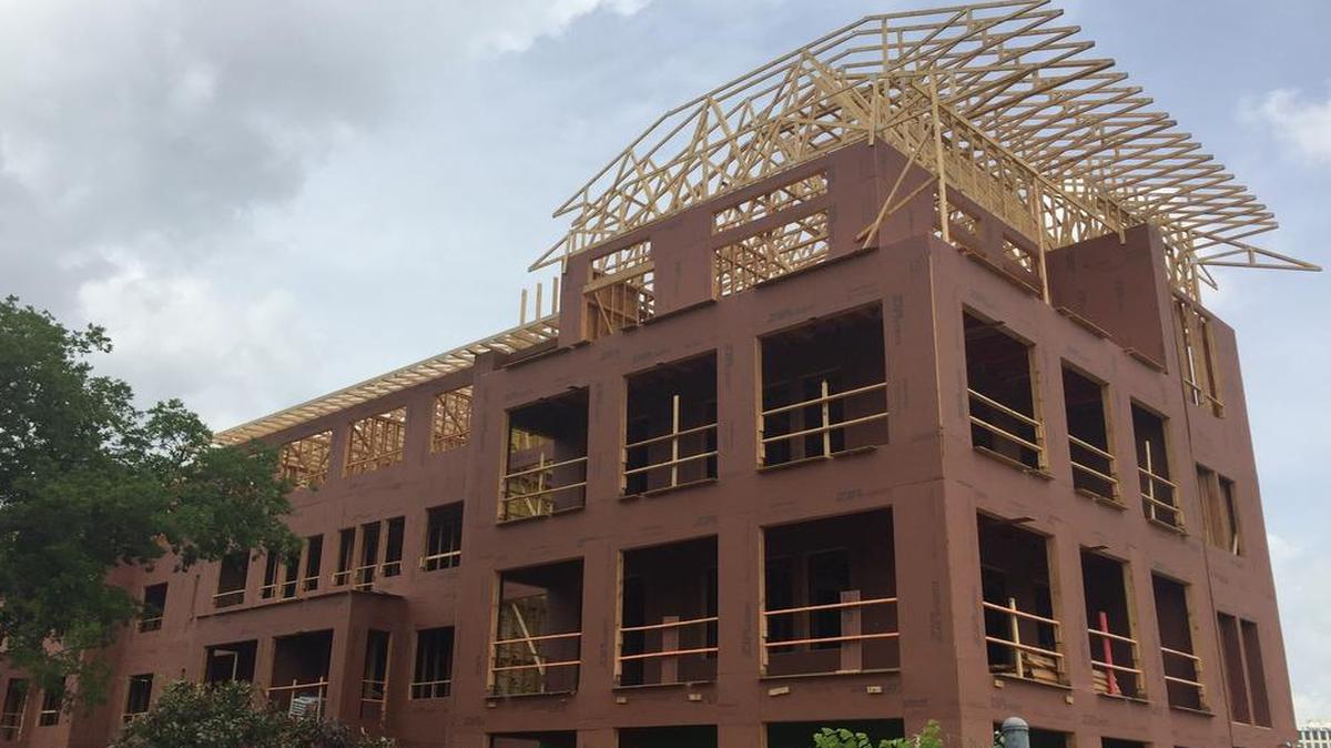 Construction continues on the Arlington Commons apartment complex, 425 E. Lamar Blvd. The first of the 353 units in the first phase will be ready for tenants in August.