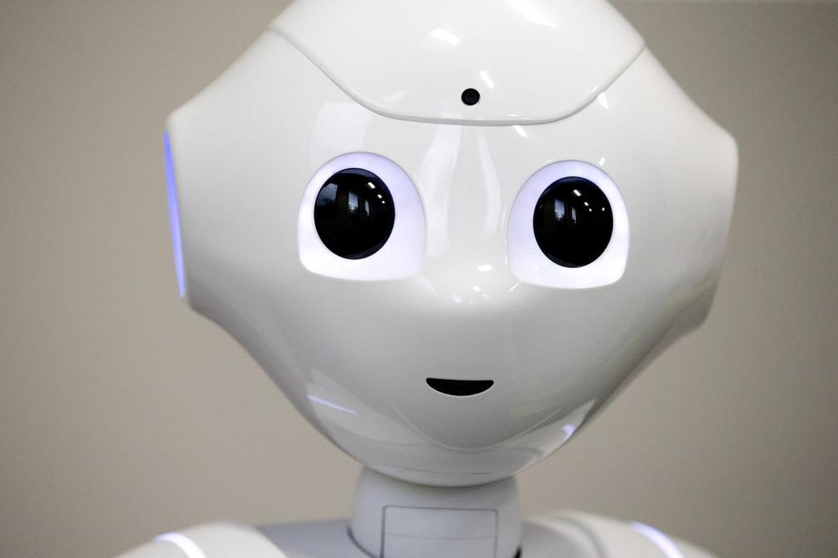 A robot named Pepper stares at the camera inside the new Emotional Robotics Living Lab at UTA on Tuesday.