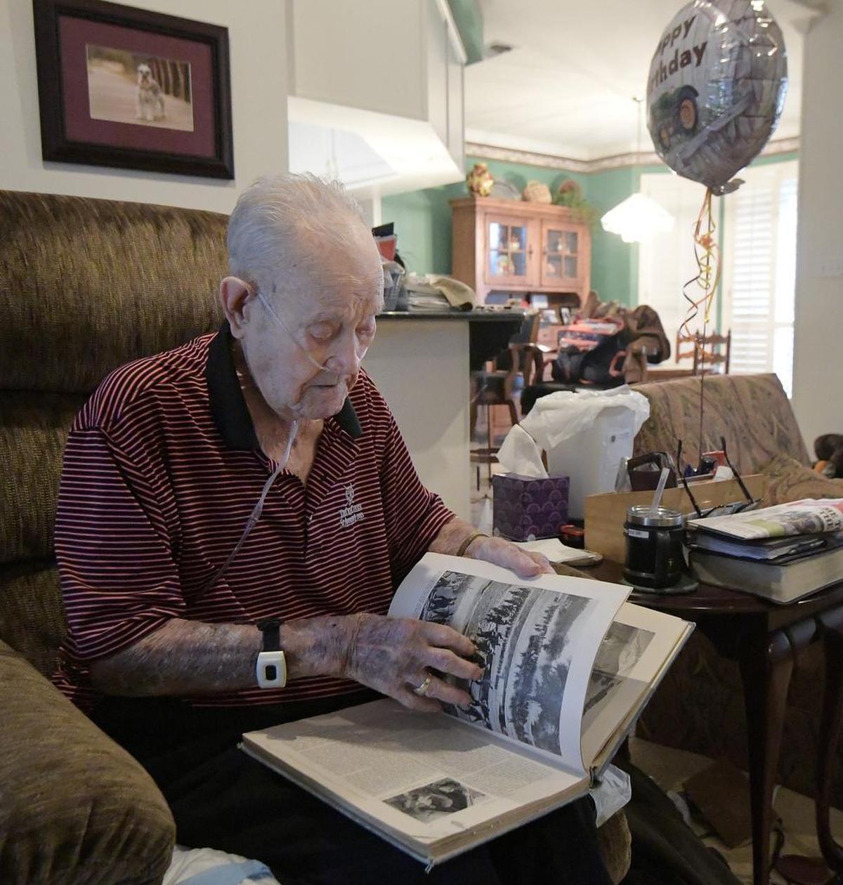 L.H. "Doc" Fox talks about his experiences in World War II at his home in Mansfield. Fox turns 100 on Friday.