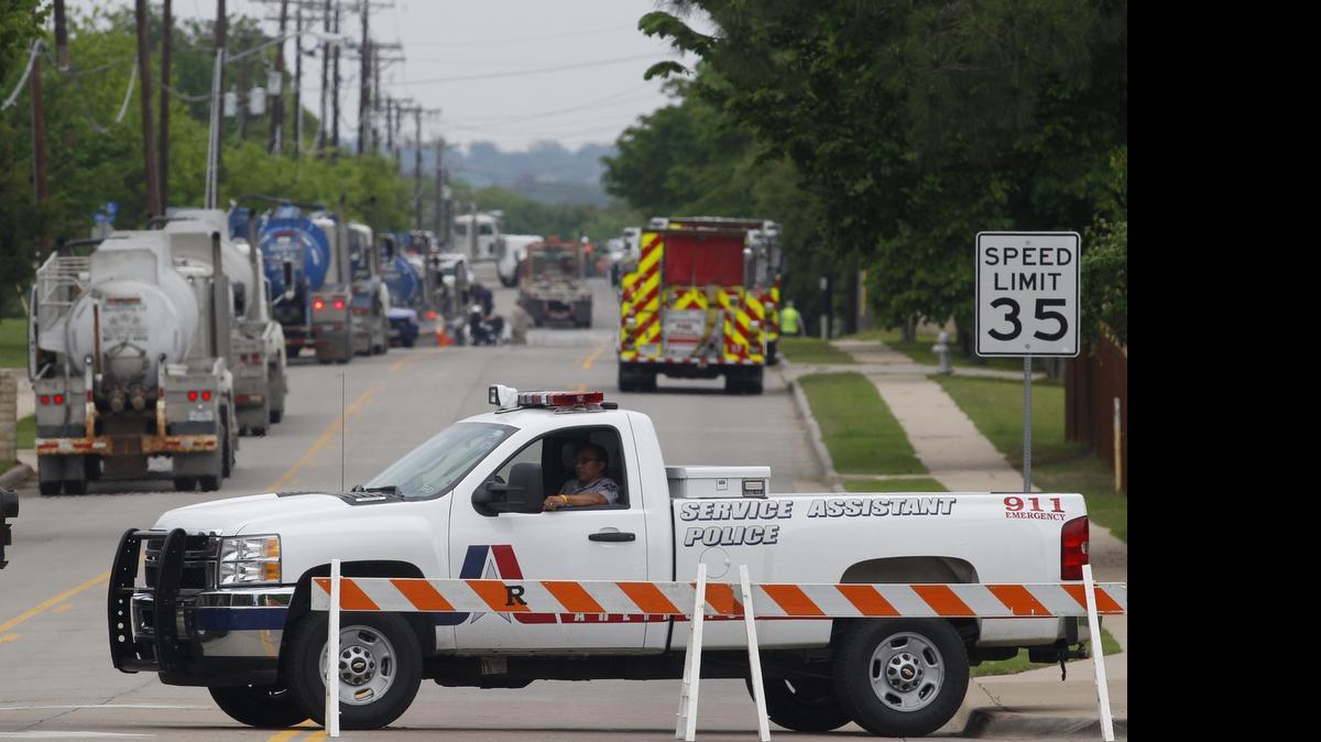 
An Arlington police department vehicle blocks the road at Little Road and Mayfield Road due to a gas leak at the Lake Arlington Church Gas Well on April 12, 2015. The Fire Department has taken a gas well operator to task and imposed rules to make sure such a leak doesn’t happen again. 
