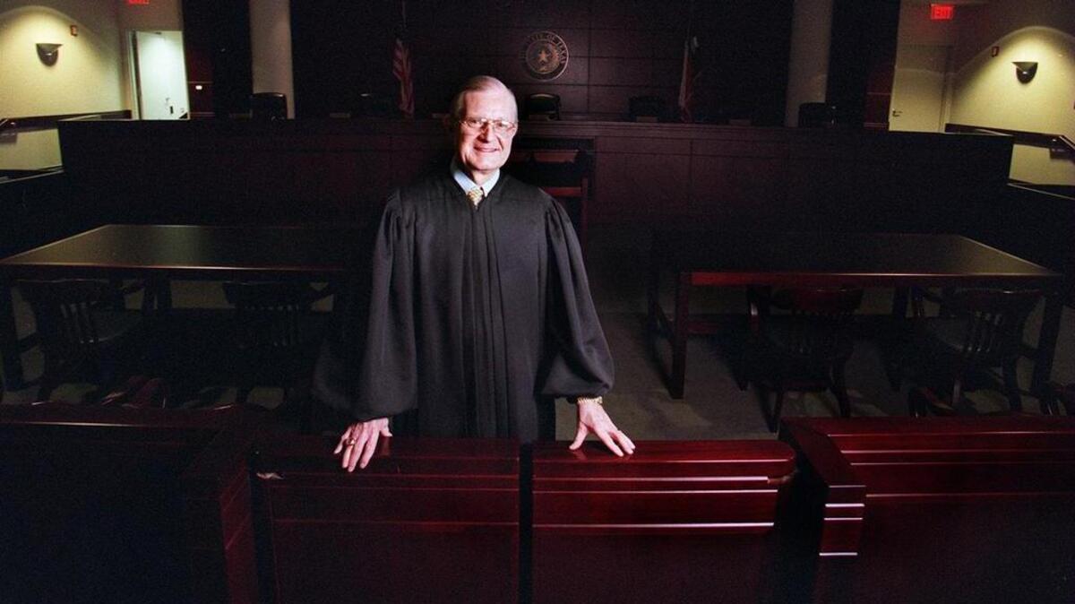 
Appeals Court Judge Dixon Holman received the Tarrant County Bar Association’s Silver Gavel Award in 2003. Dixon W. Holman, whose dual passions guided him both on a legal career that included a seat on a Fort Worth appeals court and another as a football official who ascended to the gridiron of the the National Football League, died Saturday after a lengthy battle with cancer. He was 81.

