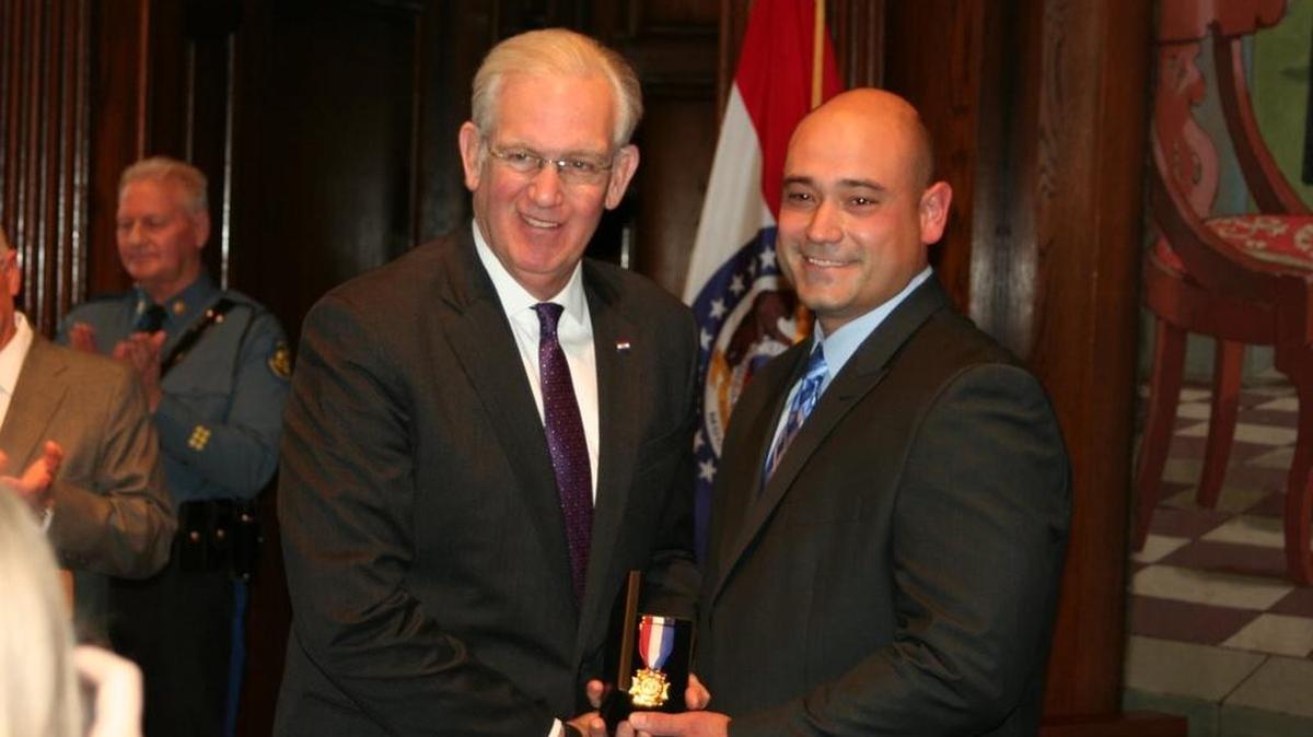Missouri Gov. Jay Nixon awarded former Boone County Sheriff Sgt. Jason Jameson with the Medal of Valor Monday for engaging a murder suspect in a shootout and killing him. Jameson is a recruit with the Arlington Police Department.