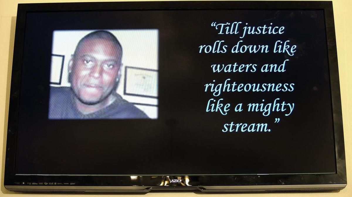 Jonathan Paul's photo was on display during a news conference last year, after two Arlington jailers were indicted in his death.