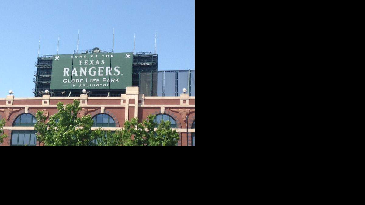 
The Globe Life Park sign hangs over the stadium of the Texas Rangers baseball team in Arlington on April 12. New street sign toppers honoring the Rangers’ stadium-naming-rights partner could be in place along Ballpark Way before the team’s home opener next month.


