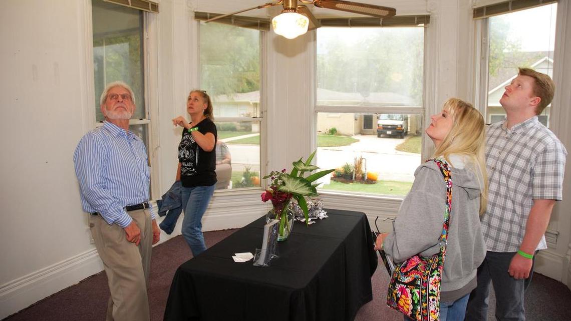Grapevine Heritage Foundation chairman Curtis Ratliff (left) shows off a house to visitors during the 2016 Grapevine Candlelight Tour of Homes. North Texas is projected to be the second-hottest housing market in the U.S. in 2018, behind only the Las Vegas area, according to Realtor.com.