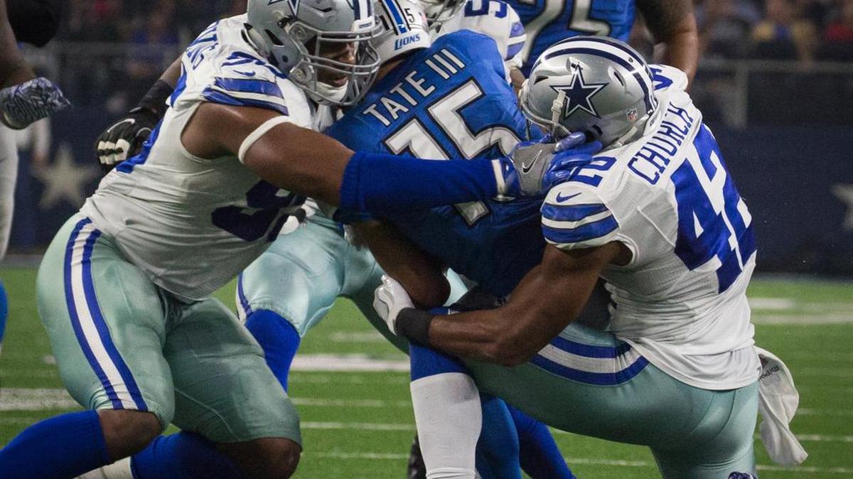 Dallas Cowboys defensive lineman David Irving (95) and safety Barry Church (42) combine to tackle Detroit Lions wide receiver Golden Tate (15) at AT&T Stadium, Monday, December 26, 2016.