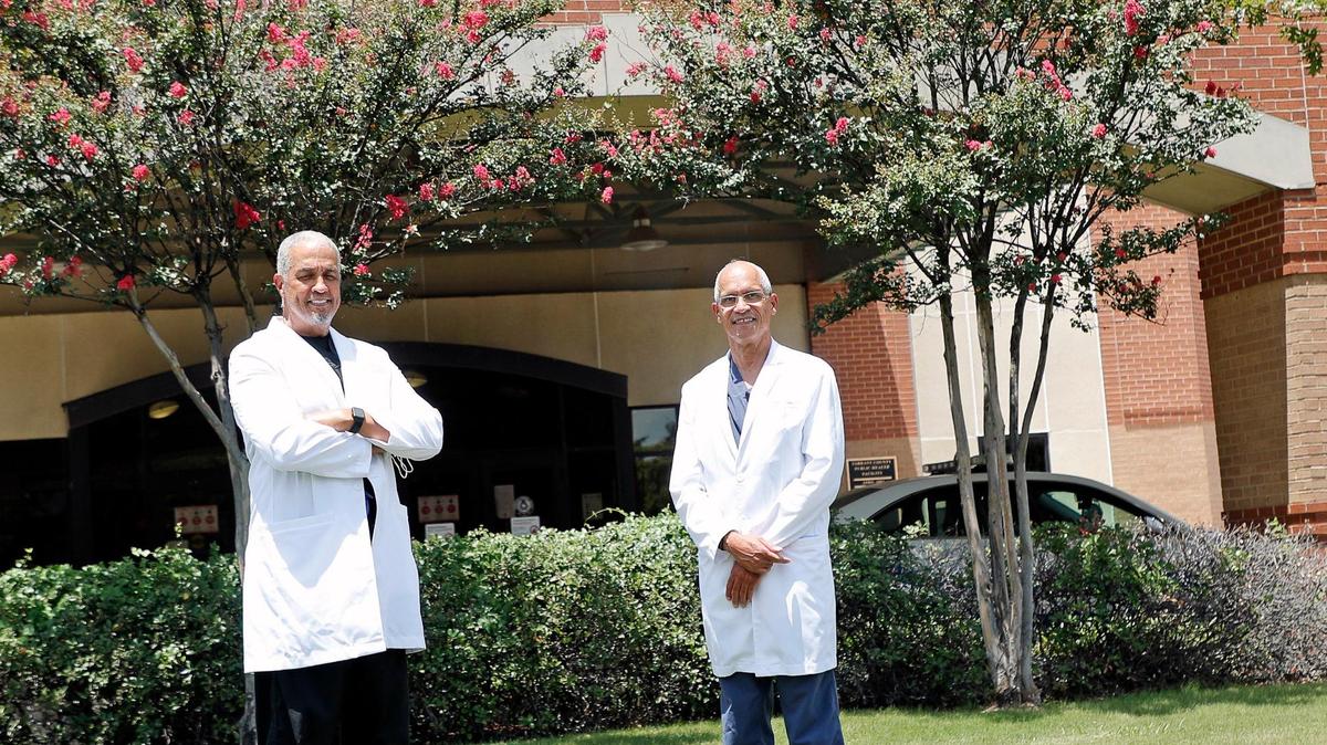 Dr. Joseph Elvis Guinn, M.D. (left) and Dr. Michael E. Brooks, M.D. stand outside the Marion J. Brooks Building in Fort Worth, named after Michael Brooks’ uncle.