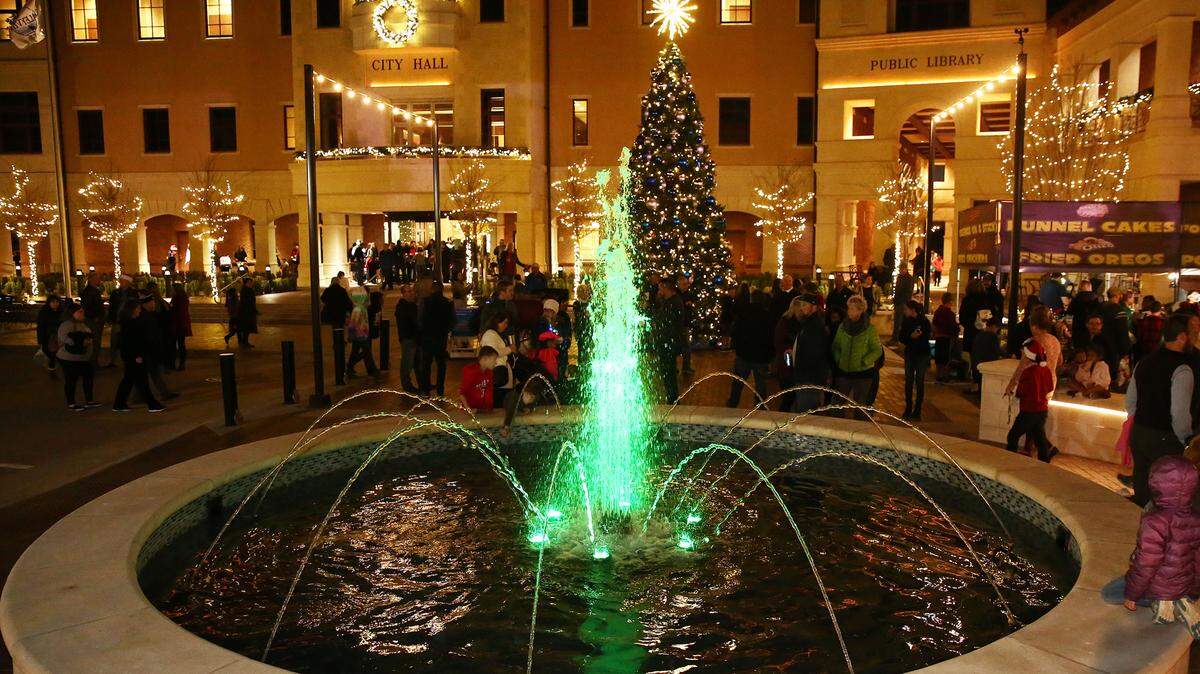 A water fountain and a Christmas tree on the background welcome residents to the newly-built plaza in Colleyville.