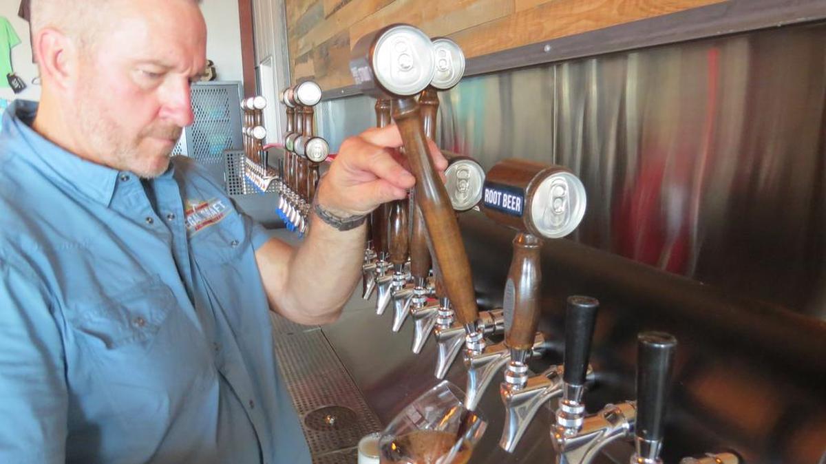 Greg McCarthy pulls a glass of Chief Justice on July 22, 2016, in the Legal Draft Beer Company tap room. Arlington City Council on Tuesday approved a $200,000 grant to help the brewery with planned expansions in 2021.