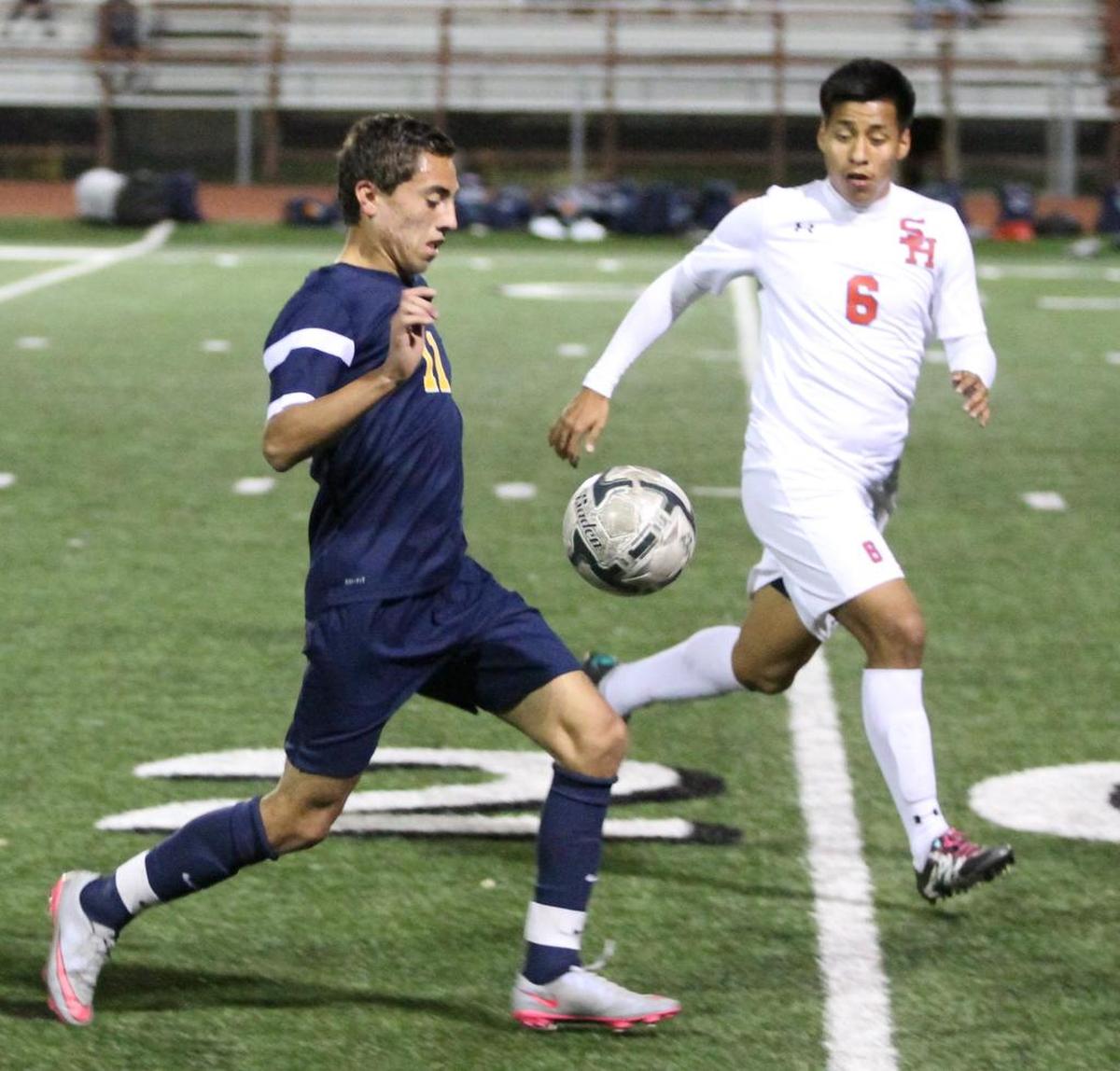 Carlos Flores, left, during his Lamar playing days.