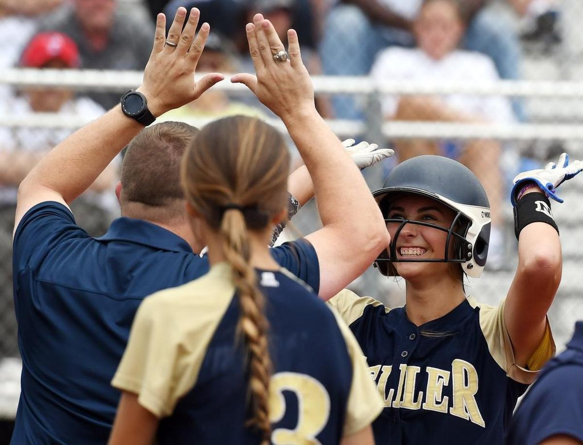 Keller’s Amanda Desario,right, celebrates as she heads to the dugout after hitting a solo home run against Plano East in the playoffs last month.