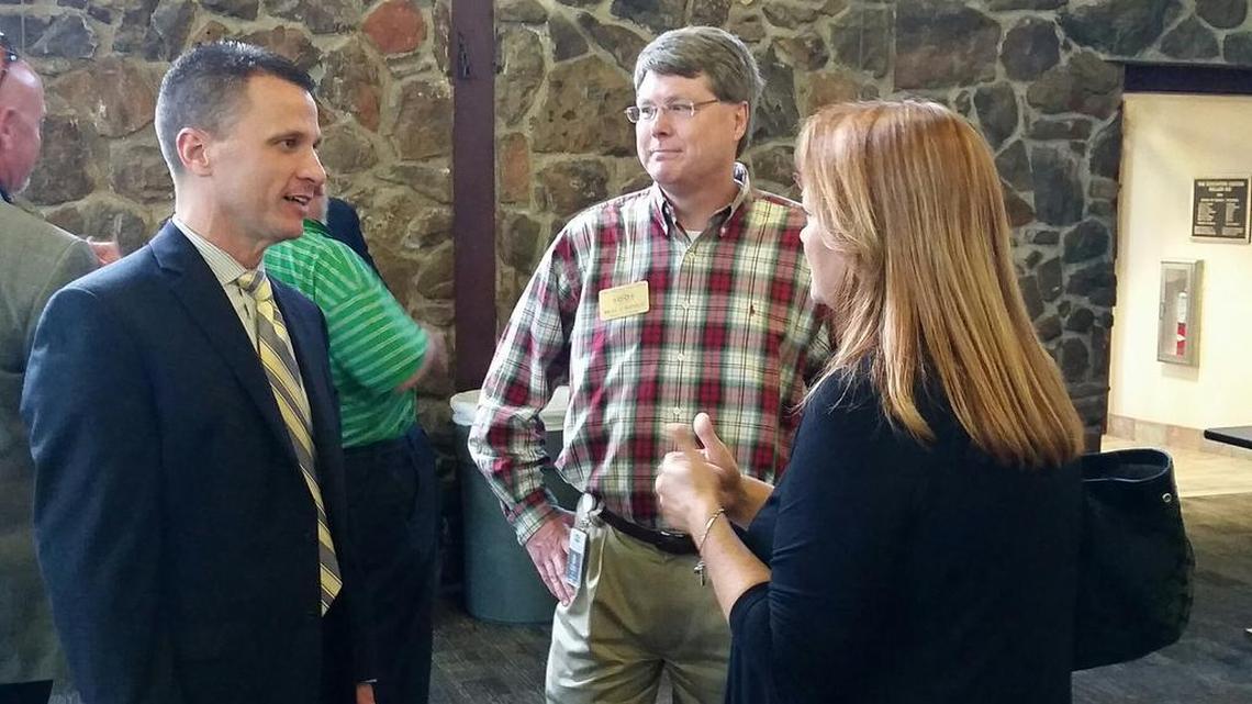Rick Westfall, far left, talks with Keller Trustee Brad Schofield and incoming Trustee Bev Dixon. Westfall was named the district’s lone finalist for superintendent at a special meeting Monday night in the Rock Gym of the Education Center.