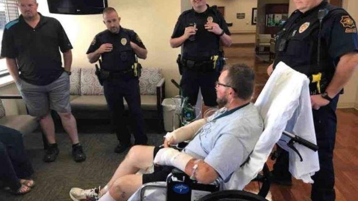 Grapevine officers Willie Lain, Caleb Goodman, Chad Hale and Greg Ross visit officer R.J. Hudson while he is on the mend.