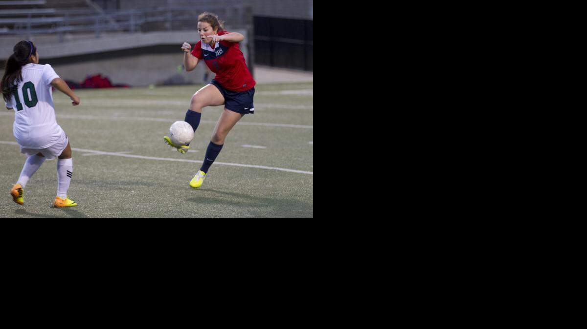 
Grapevine’s Samantha Gardner moves the ball against Birdville in recent play.
