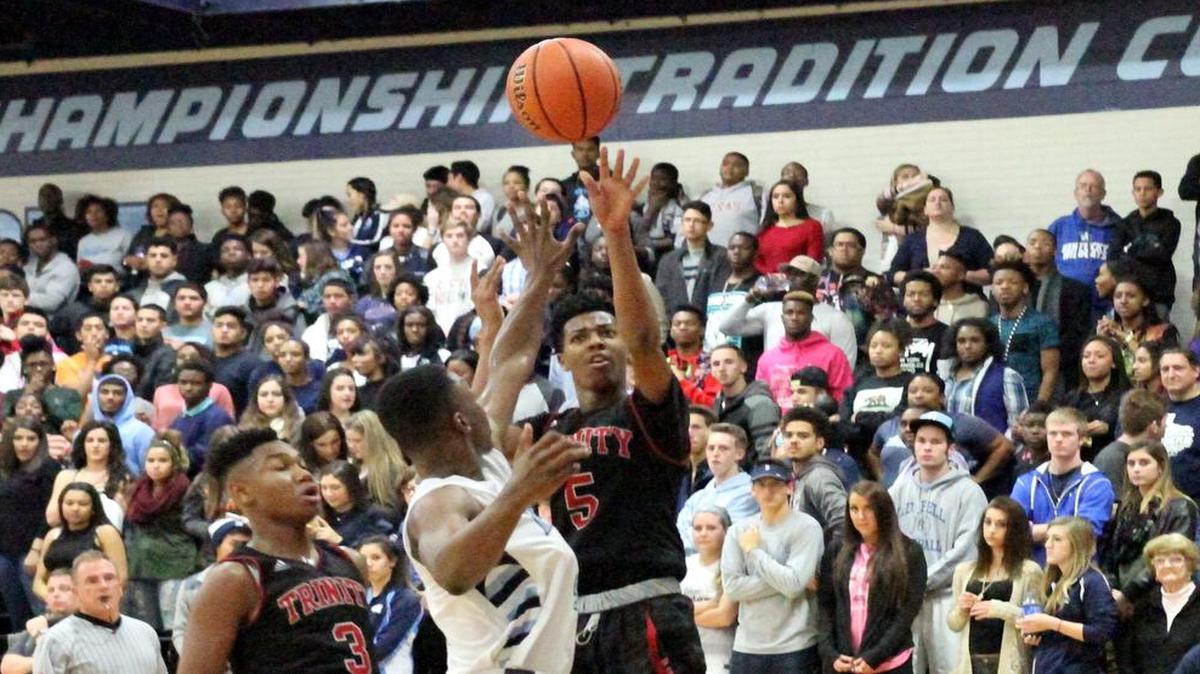 Devin Newton, right, has been one of Trinity’s leading rebounders thus far.