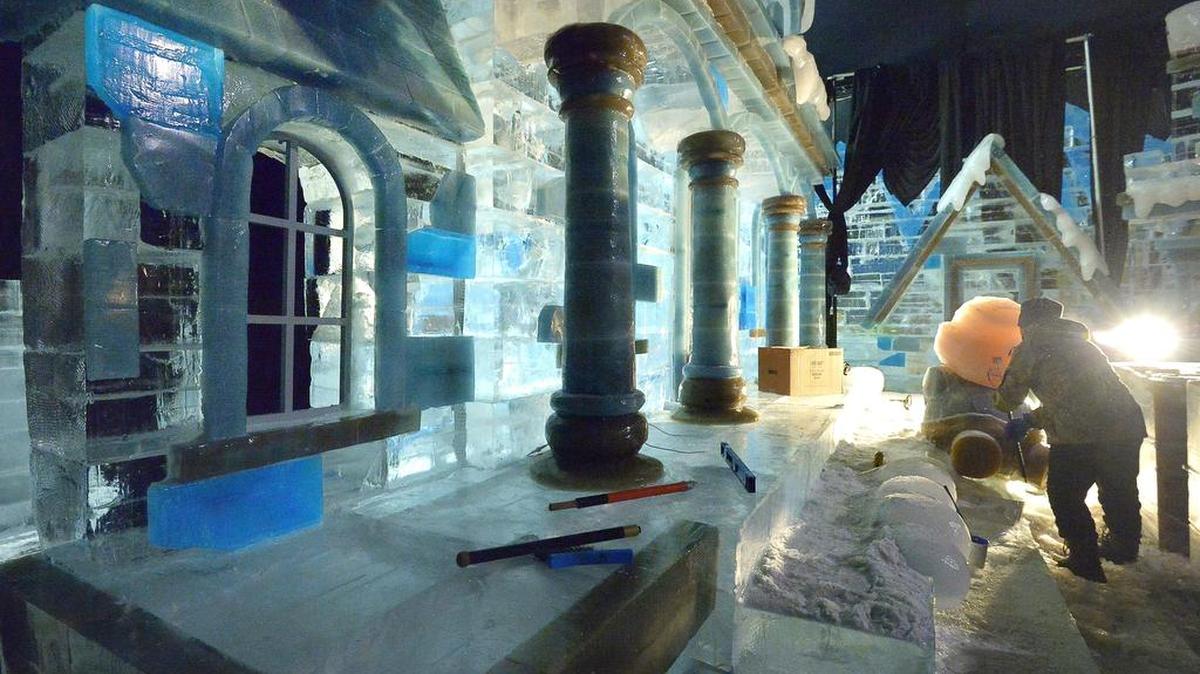 Workers sculpt at one of the exhibits at the Gaylord Texan ICE! holiday show. The exhibit with more than 2 million pounds of hand-carved ice opens Nov. 10.