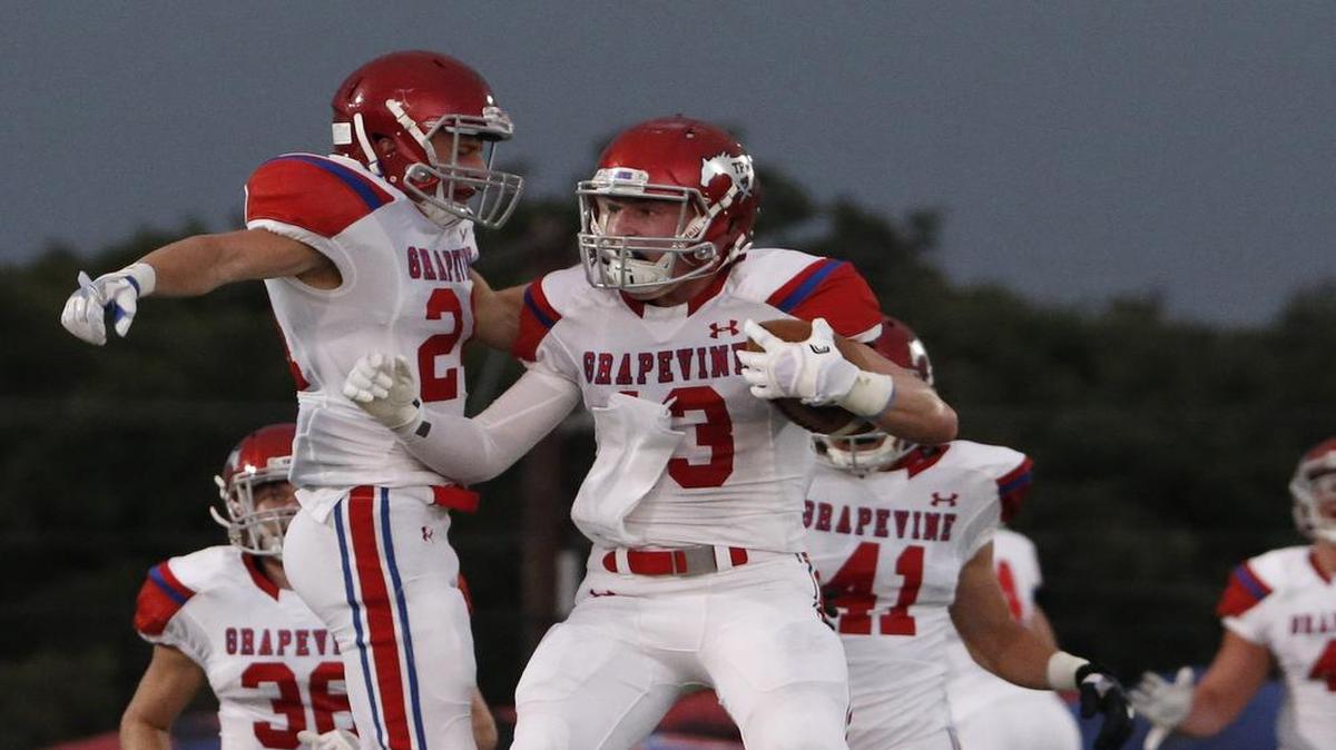 Grapevine's Zach Rice (13) and teammate Eric Brown (24) celebrate after Rice intercepted Azle last week, one of the defense’s six turnovers created.