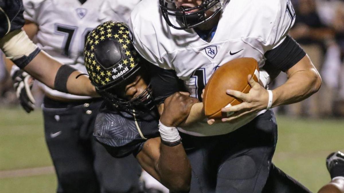 Fossil Ridge defensive lineman Tyler Mitchell, left, gets a sack last season against Byron Nelson. He should be part of another big recruiting class in 2017.