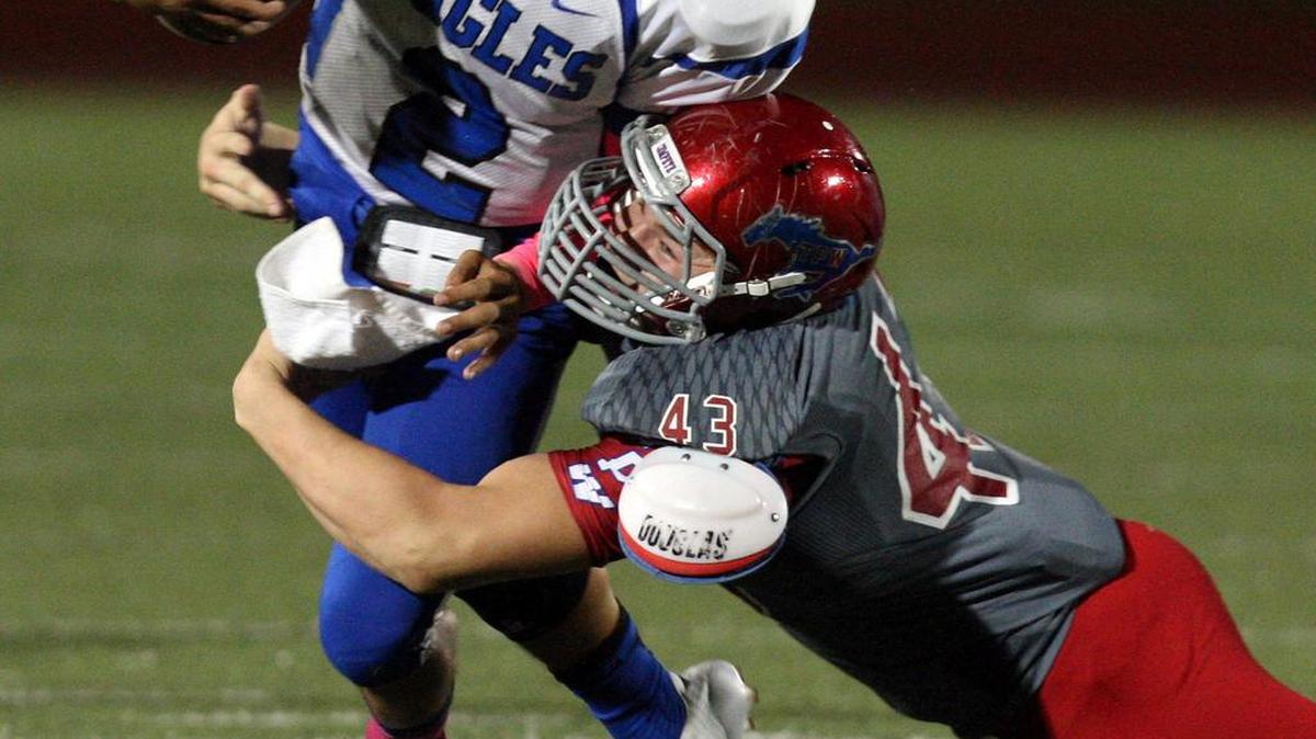 Grapevine’s Brian Andrews, right, uses leverage to take down opposing offensive players.