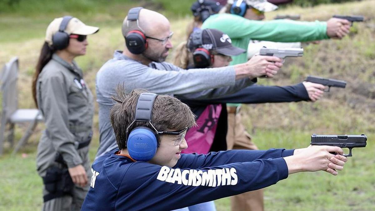 Students shoot at targets during Jennifer Coffindaffer's self-defense and tactical firearms class.