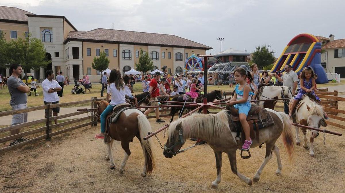 Children enjoyed pony rides at the outdoor Summer Reading Grand Finale at the Colleyville Public Library last week. The reading program is held annually.