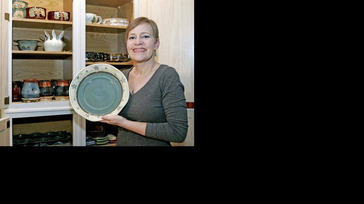 
Karen Ahaus shows some of her favorite pottery pieces. 
