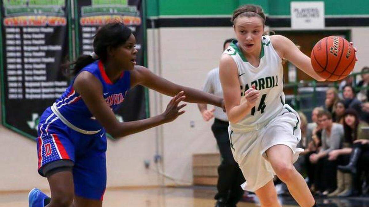 Carroll point guard Kennedy Leonard (14), right