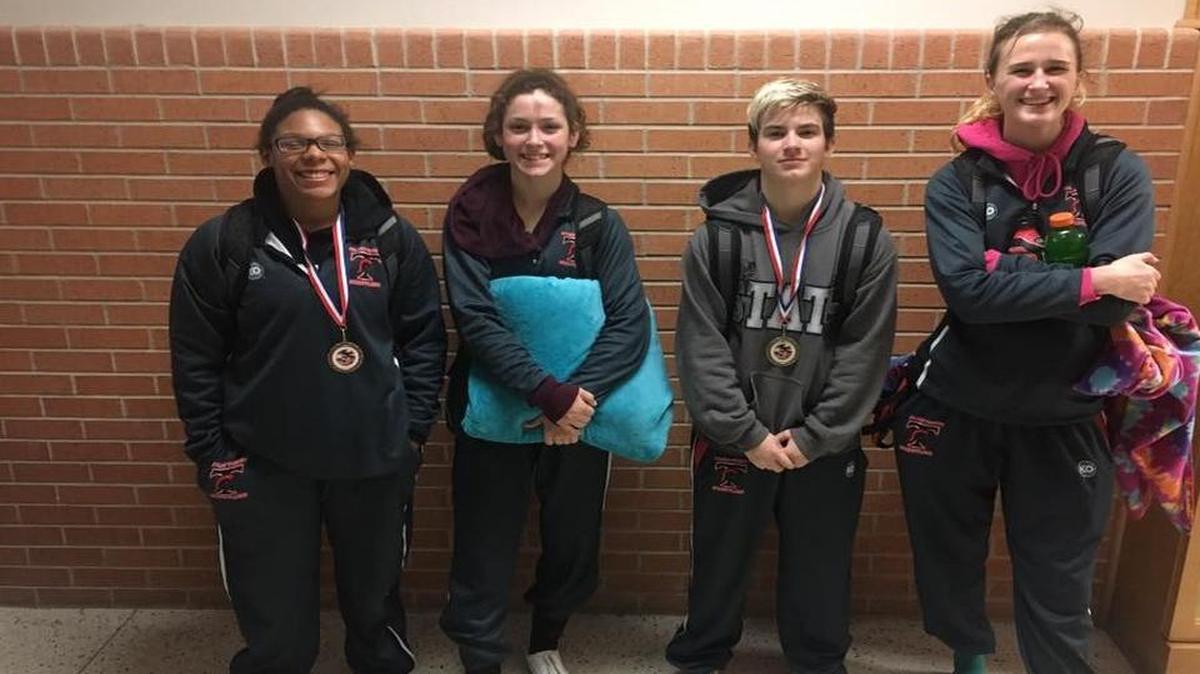 From left, Passion Hollins, Carmen Allred, Mack Beggs and Savannah Bye are a few of the Trinity wrestlers off to a strong start this season.