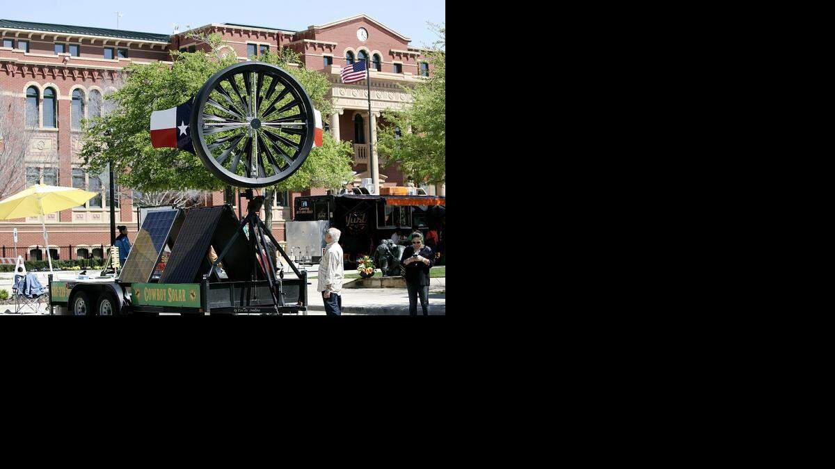 
A giant electric generating wind turban sits outside Southlake City Hall during Greenfest at Southlake Town Square Saturday afternoon March 28, 2015. The event included bounce houses for kids, energy savings booths and healthcare items.

