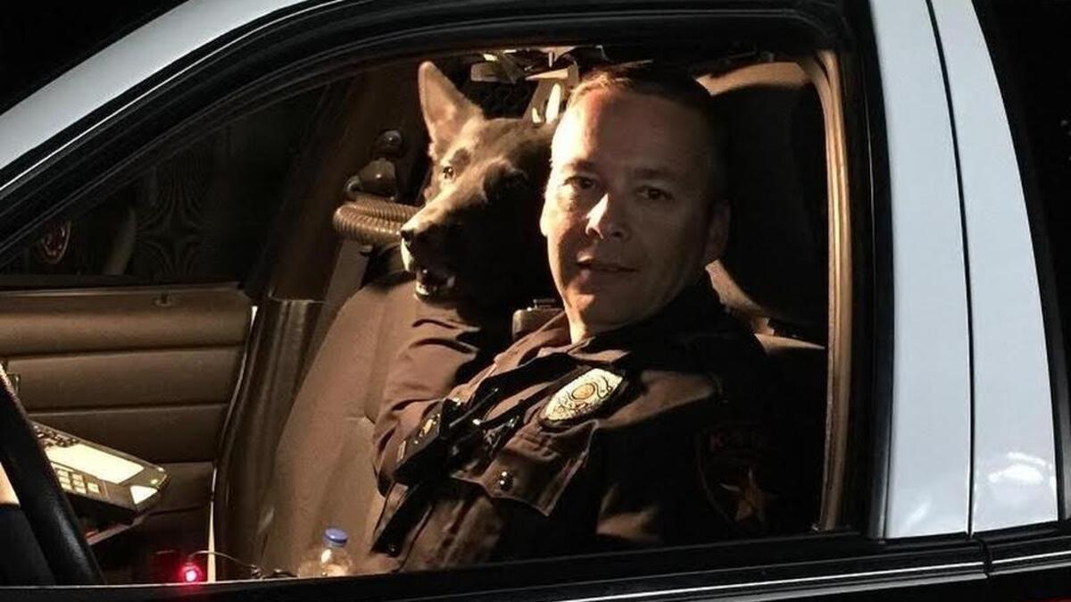 Immo and Lewisville officer Shane Menz on patrol. Immo retired in April 2015, but he was put down over the weekend after becoming ill.