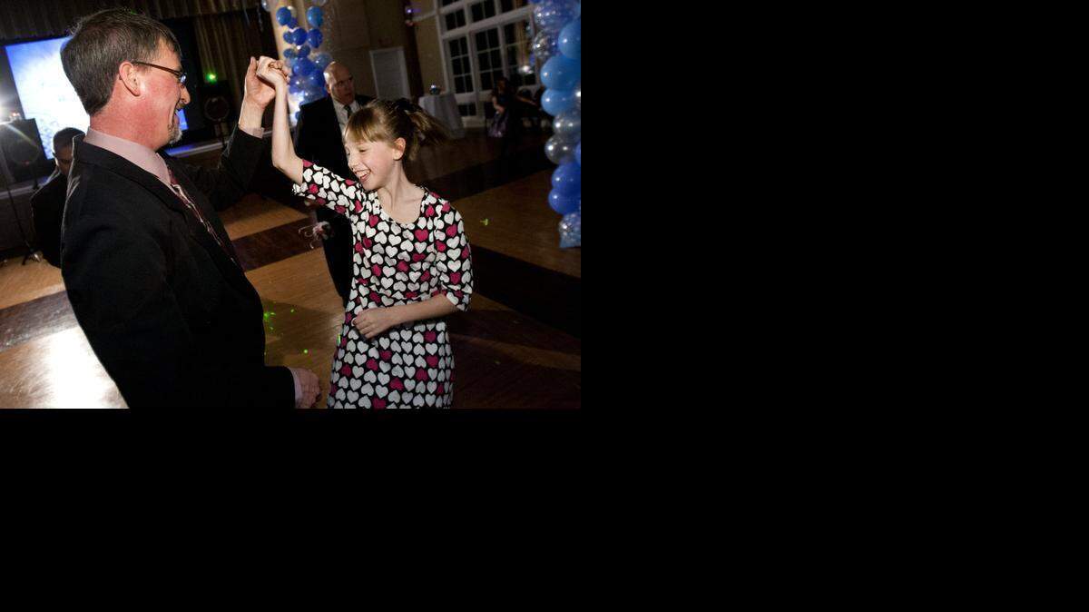 
Emory Kirchen on the dance floor with her father, Chris at the Winter Ball event at the Colleyville Center.


