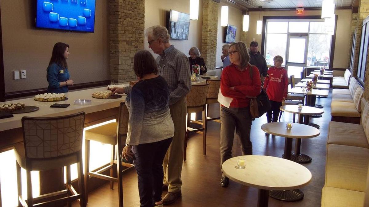Residents and visitors tour the Club Lounge at The Marq open house Saturday in Southlake.