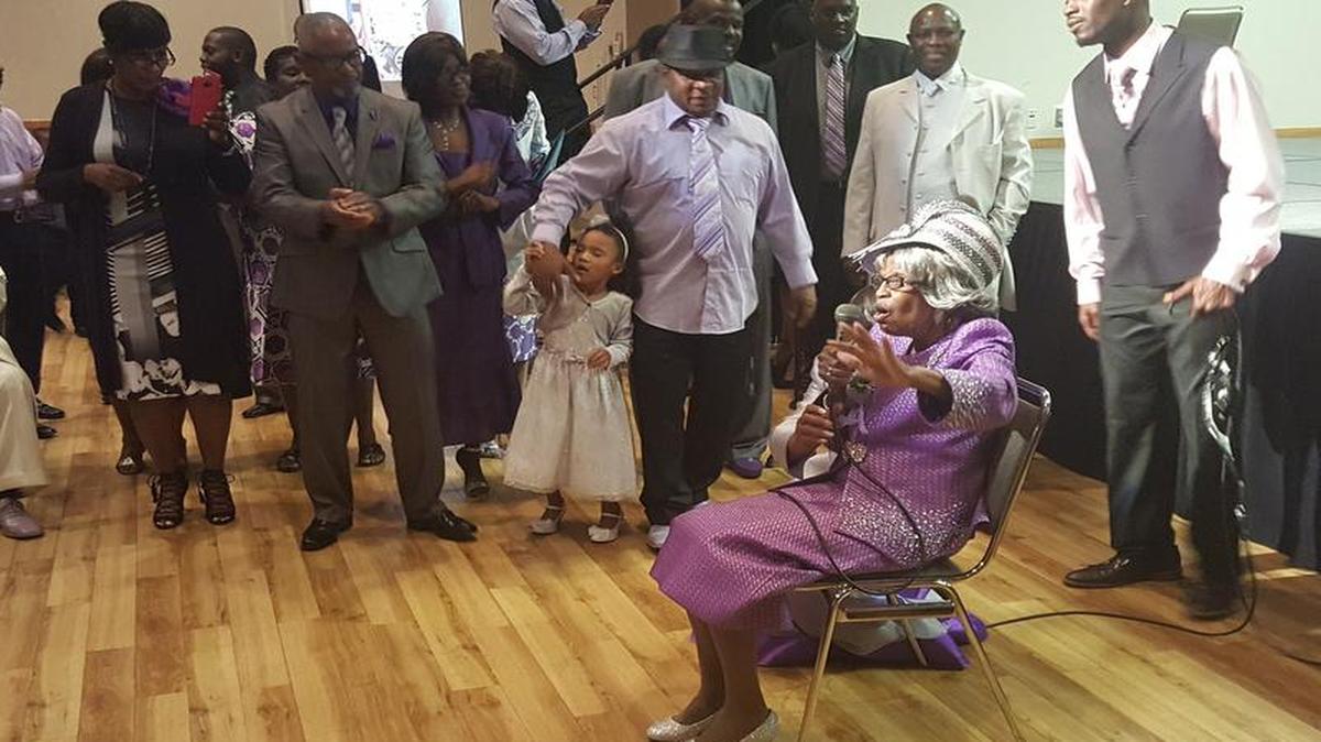 Eliza Brewer sings a Gospel song to the more than 200 people who came to her 90th birthday party in Grapevine.