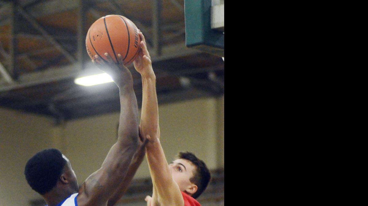 
Grapevine's Andrew Lastinger blocks an Eastern Hills player’s shot last season.
