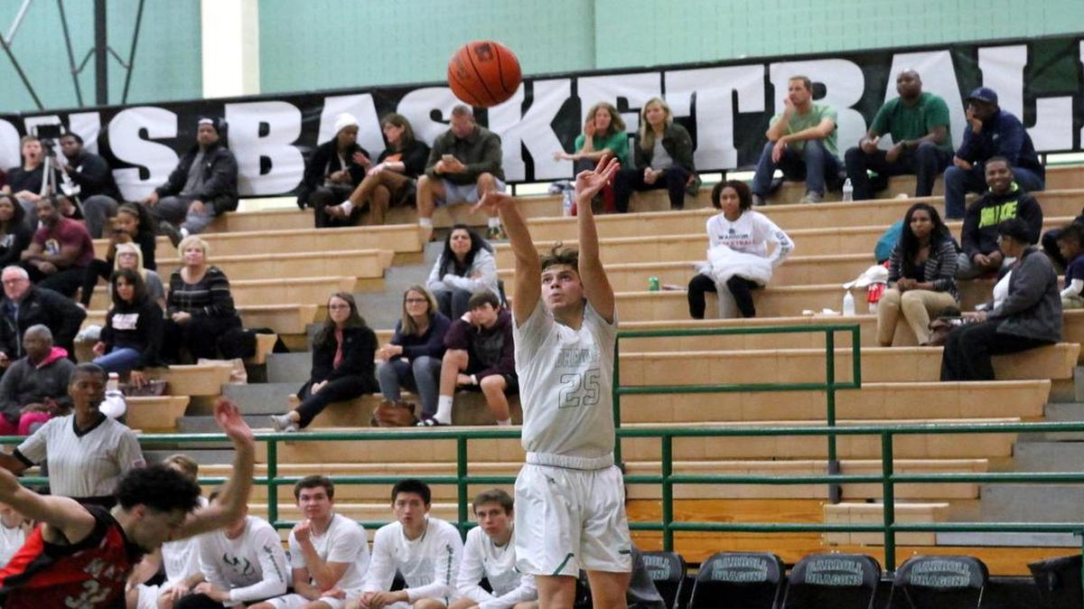 Carroll’s Sam Bourcy shoots in Tuesday’s victory over Arlington Martin.