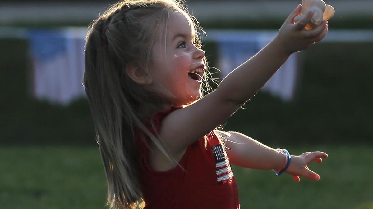 LexiAnn Moyer plays with her mother at the event.