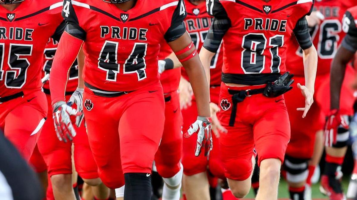 The Colleyville Heritage Panthers run on the field before the game against the Euless Trinity Trojans, Friday, Sept. 9, 2016, at Mustang-Panthers Stadium in Grapevine.