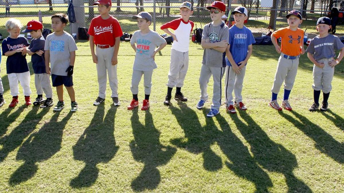 Kids line up for warm ups at a baseball camp at the Parks at Texas Star in Euless on July 20. Phase 6 of renovating the Texas Star complex is scheduled for completion during the coming budget year with new synthetic turf for the infields and additional parking.