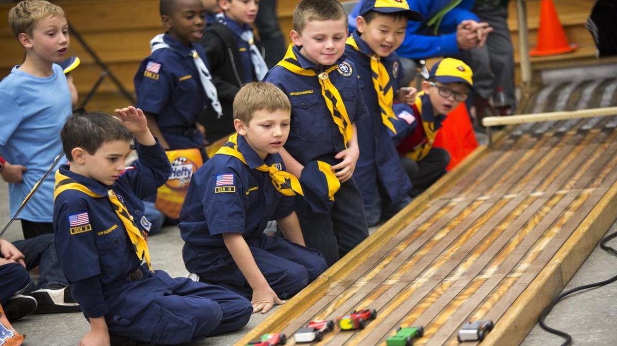 Scouts watch their cars race down the track during Cub Scout Pack 817’s pinewood derby at Grapevine Elementary School. Crestmont Baptist Church of Burleson provided the track and hosts derbies across the state.