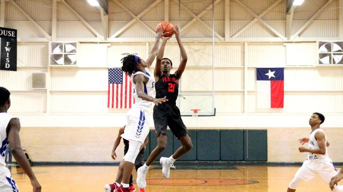 Mohamed Idris shoots in recent district action. The senior has averaged seven rebounds per game in district.
