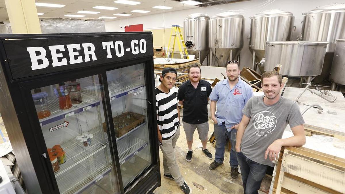 Owners J.P Goytia, Alex Knight, James Peery and Josh Davis spend their evenings putting together Turning Point Beer, a craft brew pub under construction in Bedford.